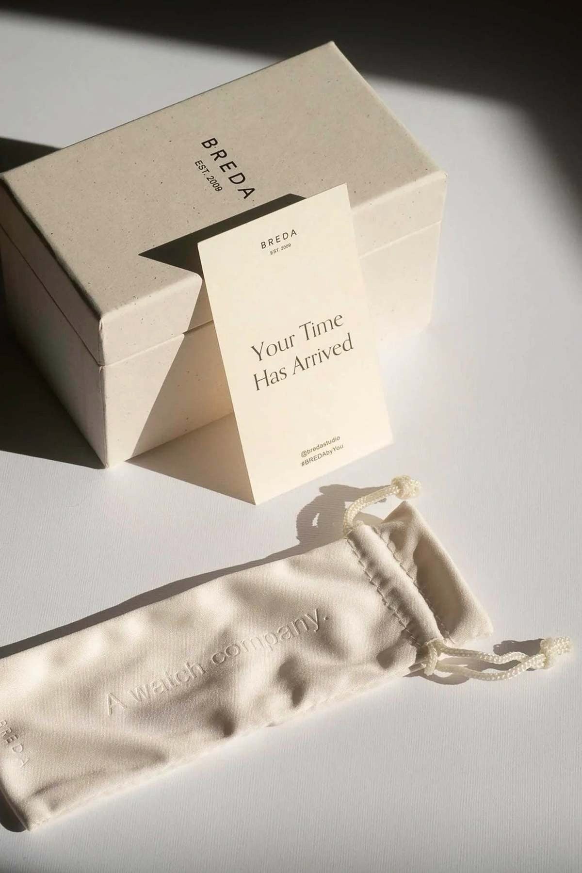 BREDA watch gift packaging with branded box, cream storage pouch and Your Time Has Arrived card