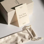 BREDA watch packaging with branded box, cream storage pouch and Your Time Has Arrived card