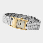 BREDA Revel two tone watch with curved silver bracelet, gold case and jewelry clasp on light gray background