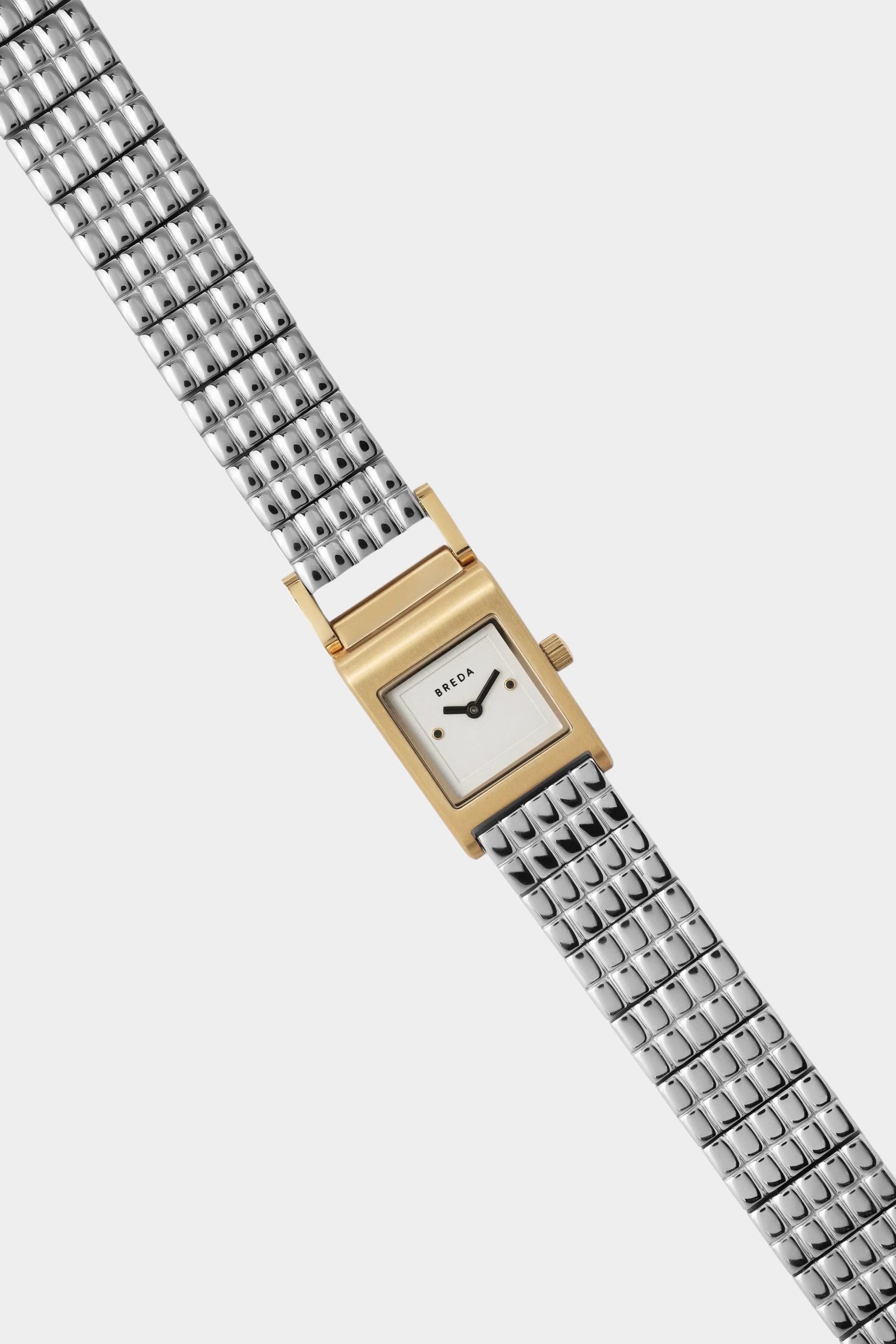 BREDA Revel gold and silver watch with petite square dial and polished stainless steel bracelet at YUCCA Denver