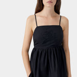 Black camisole with tonal embroidery at bust, thin straps, and structured upper panel