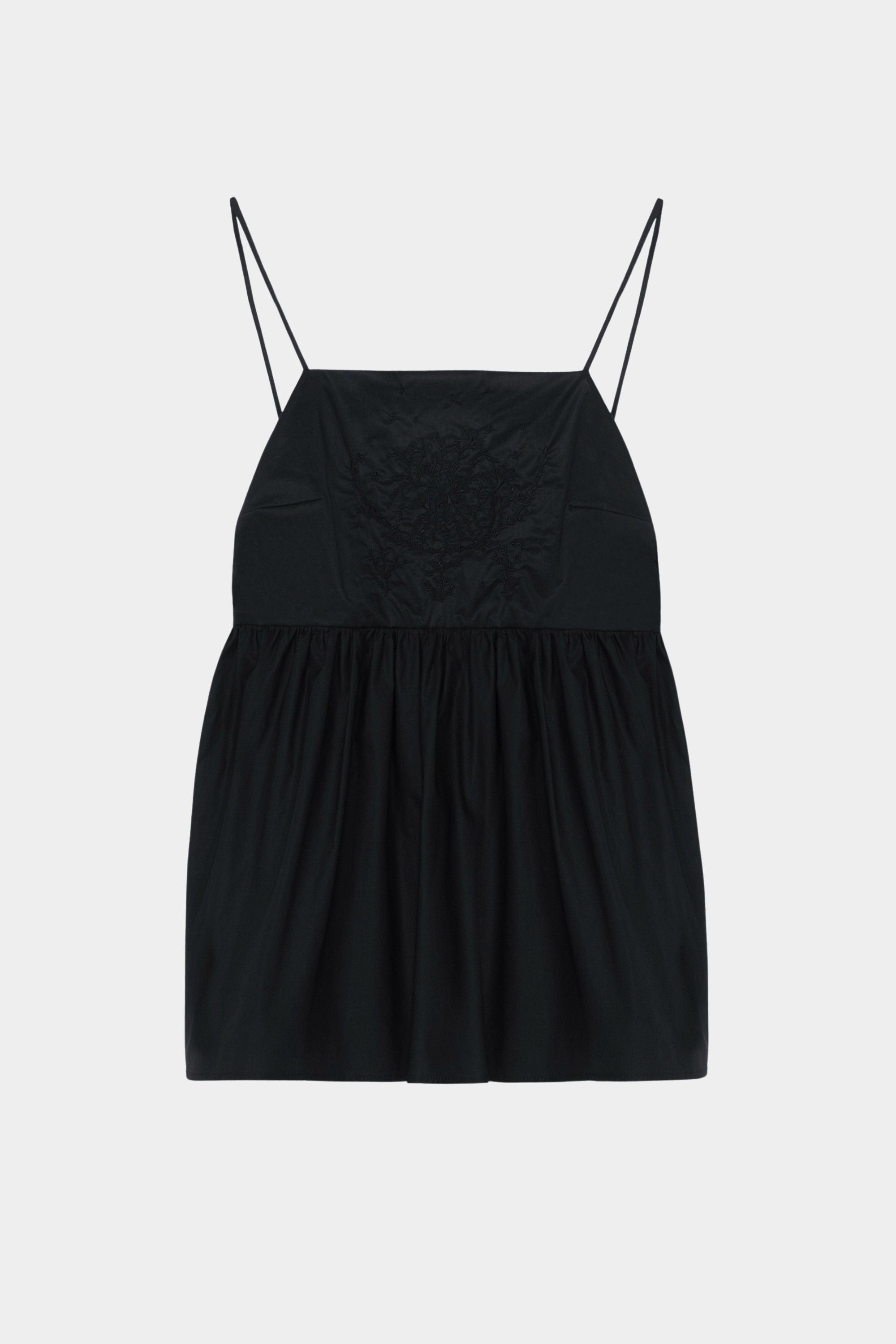 Black cotton camisole top with tonal embroidered motif, thin straps, and gathered waist seam