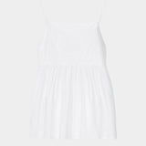 White cotton camisole top with tonal embroidery, thin straps, and gathered waist seam
