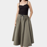 Brown ribbed knit tank top worn with full skirt and sandals