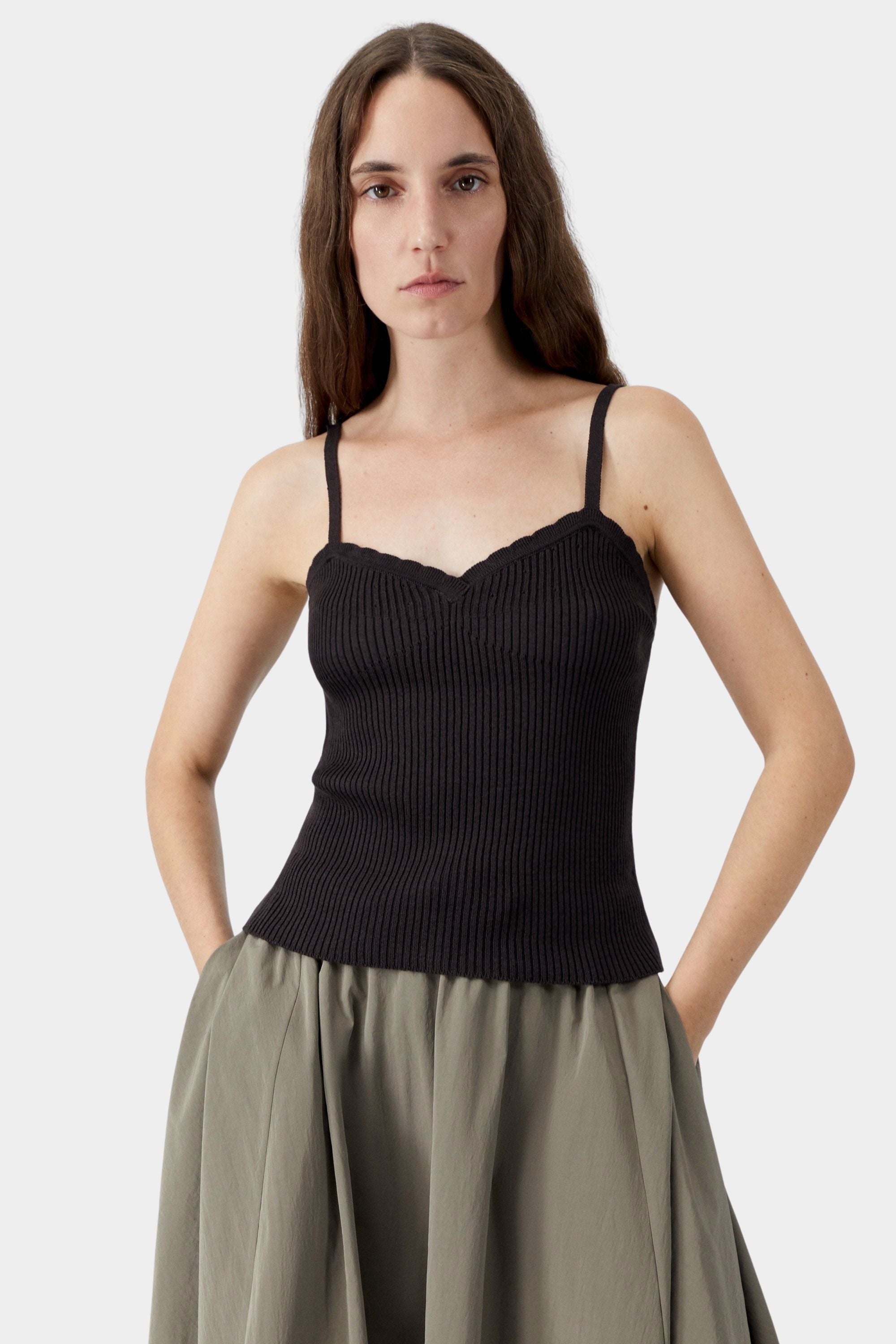 Brown ribbed knit tank top with thin straps and scalloped neckline