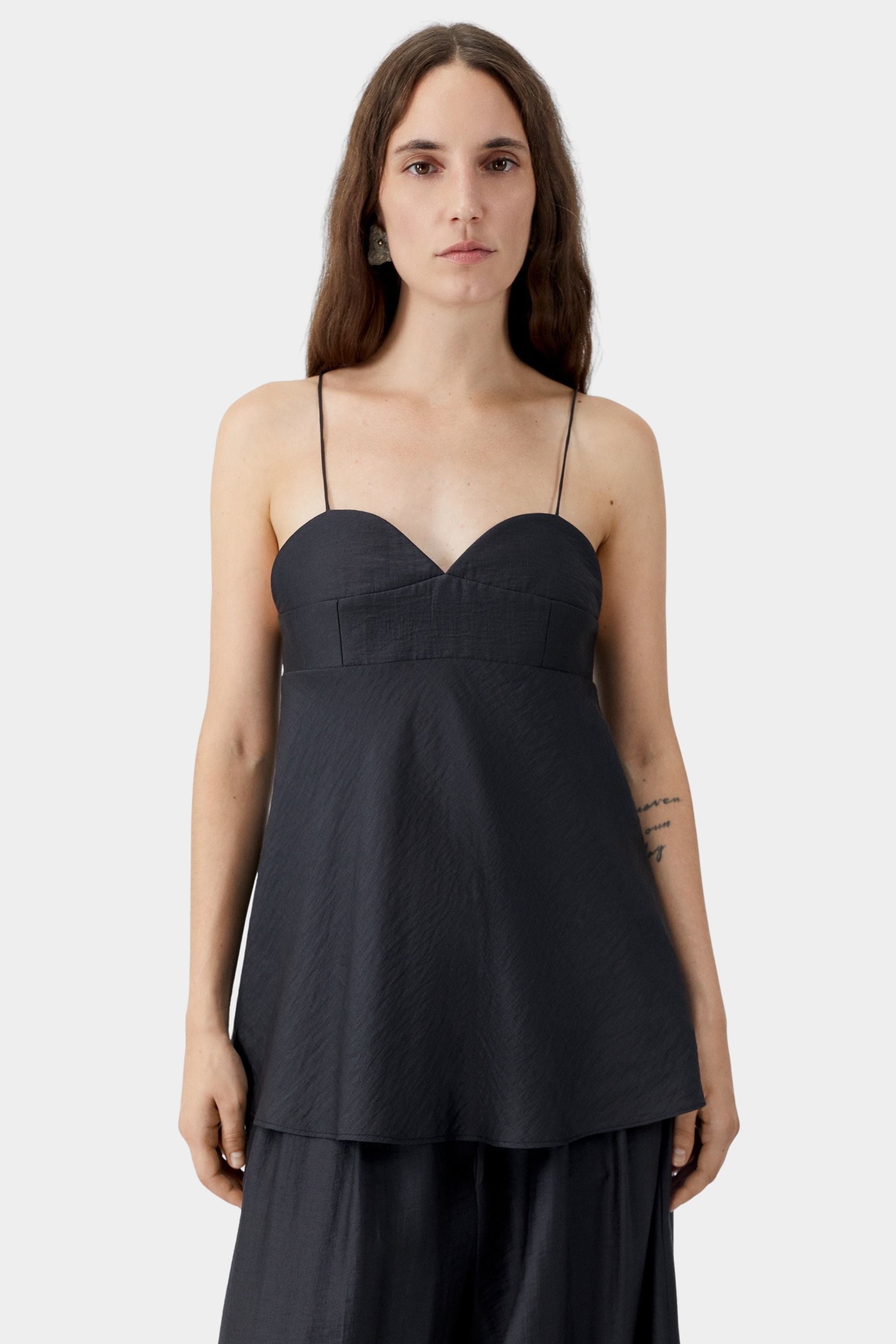 Black heart-shaped neckline camisole with thin straps, structured bust, and soft drape