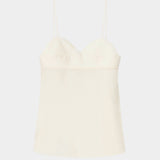 Cream heart-shaped camisole top with thin straps, structured bust, and lightly textured fabric