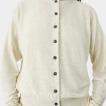 Cream flecked knit cardigan with button front closure and subtle texture