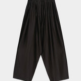 Black maxi pants with elastic waistband, drawstring closure, and wide leg silhouette