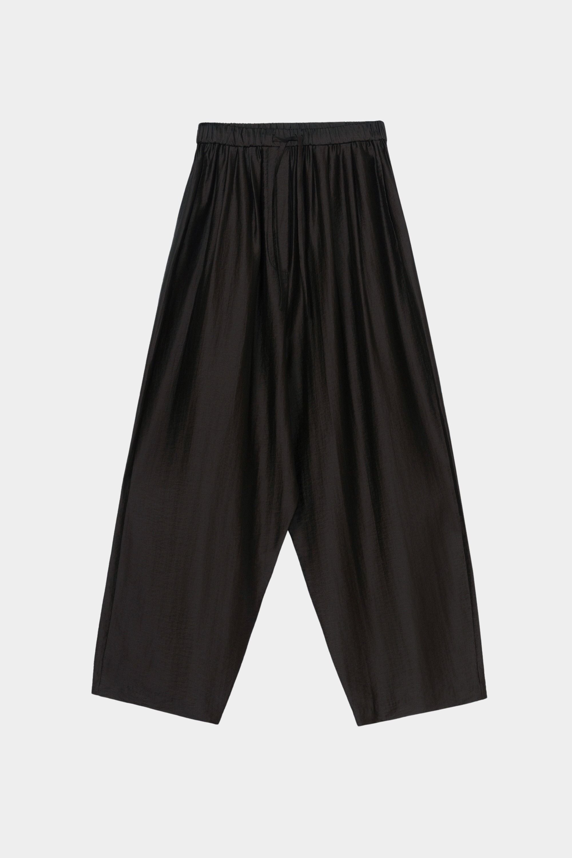 Black maxi pants with elastic waistband, drawstring closure, and wide leg silhouette