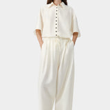 Marfil cream wide leg pants with elastic waist and soft drape, worn with matching short sleeve shirt