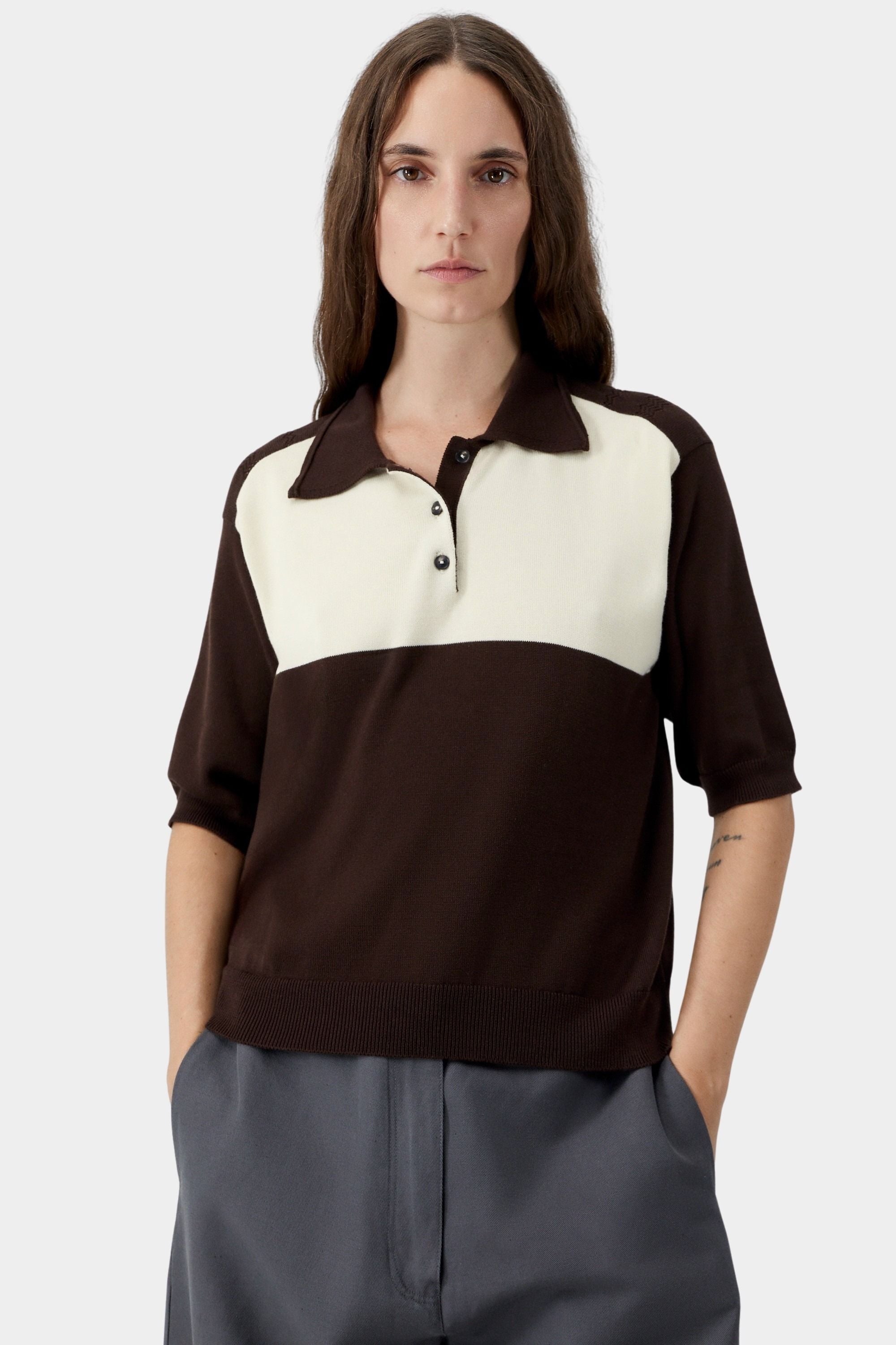Brown and cream colorblock knit polo with button placket, soft collar, and fine gauge organic cotton texture