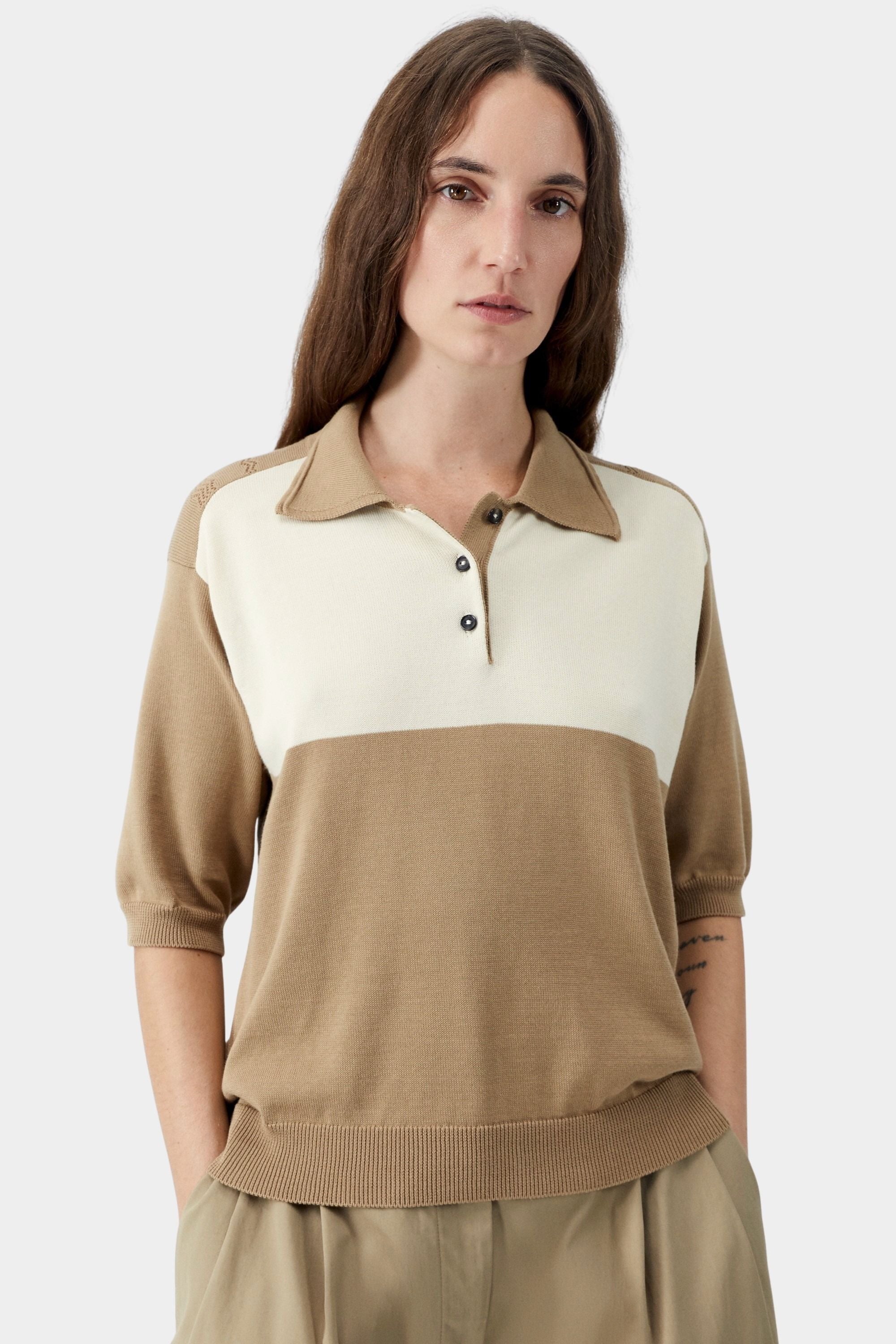 Camel and cream colorblock knit polo with button placket, soft collar, and fine gauge organic cotton texture