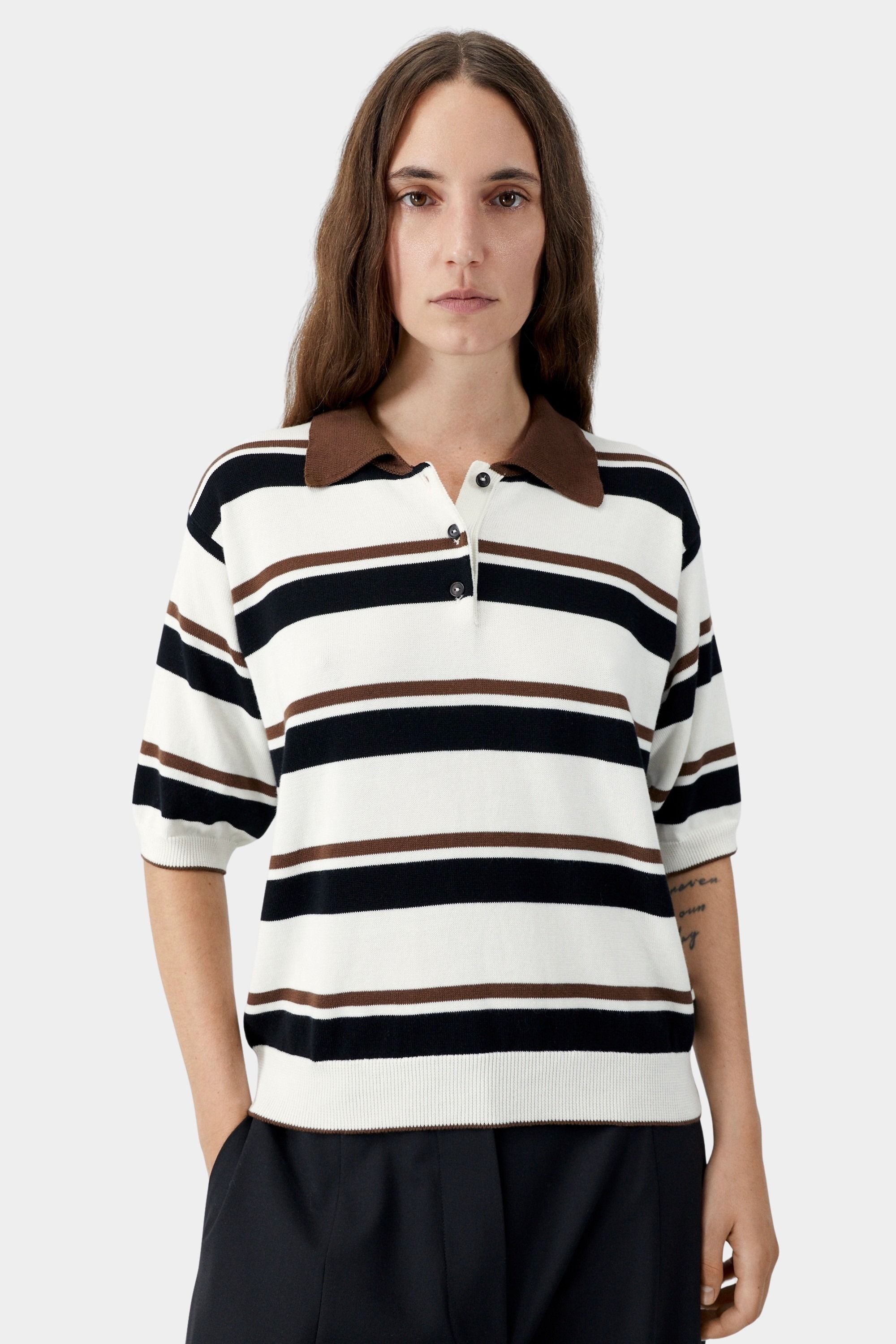 Striped knit polo with brown collar, short sleeves, and button placket detail