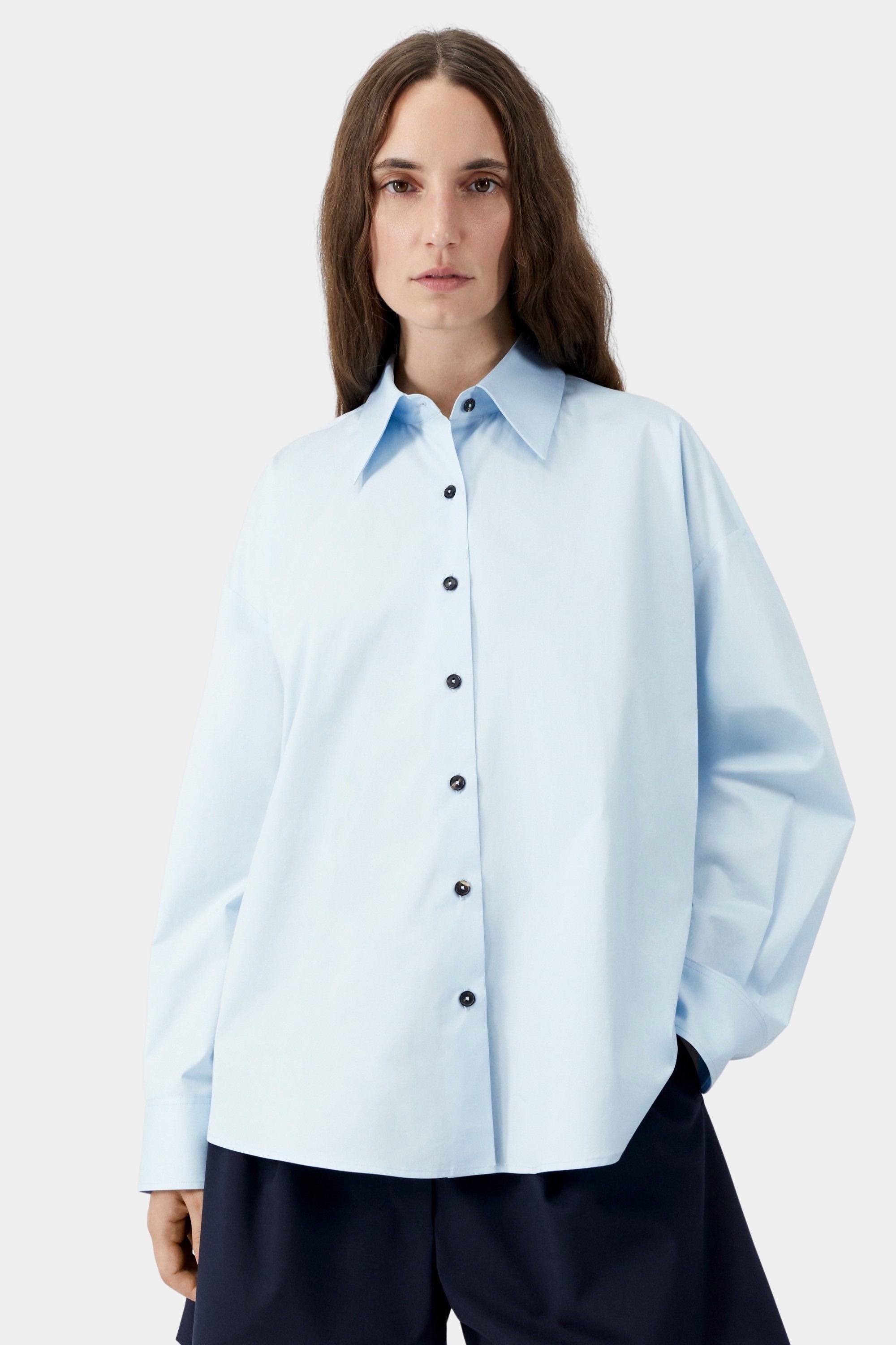 Light blue oversized shirt with dropped shoulder and clean placket