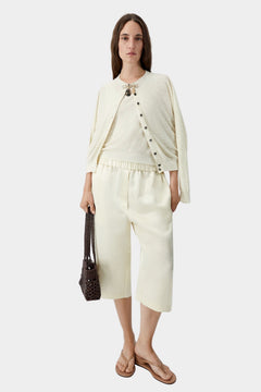 Cordera satin capri pants in marfil styled with matching knit top and cardigan, relaxed fit and fluid movement