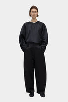 CORDERA | Satin Curved Pants - Black - SHOP YUCCA Bottoms CORDERA- YUCCA Artistic clothing for women, boutique near me, boutique stores near me, cherry creek boutiques, fashion for women over 50