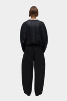 CORDERA | Satin Curved Pants - Black - SHOP YUCCA Bottoms CORDERA- YUCCA Artistic clothing for women, boutique near me, boutique stores near me, cherry creek boutiques, fashion for women over 50