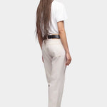 DALA Calla mid rise straight ankle jeans in salt, back view on model with black belt and boots