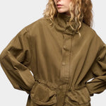 DALA Mountain Jacket Dark Olive detail with high collar, toggle waist and utility pockets at YUCCA Denver