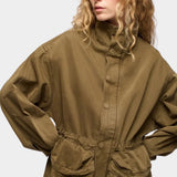 DALA Mountain Jacket Dark Olive detail with high collar, toggle waist and utility pockets at YUCCA Denver