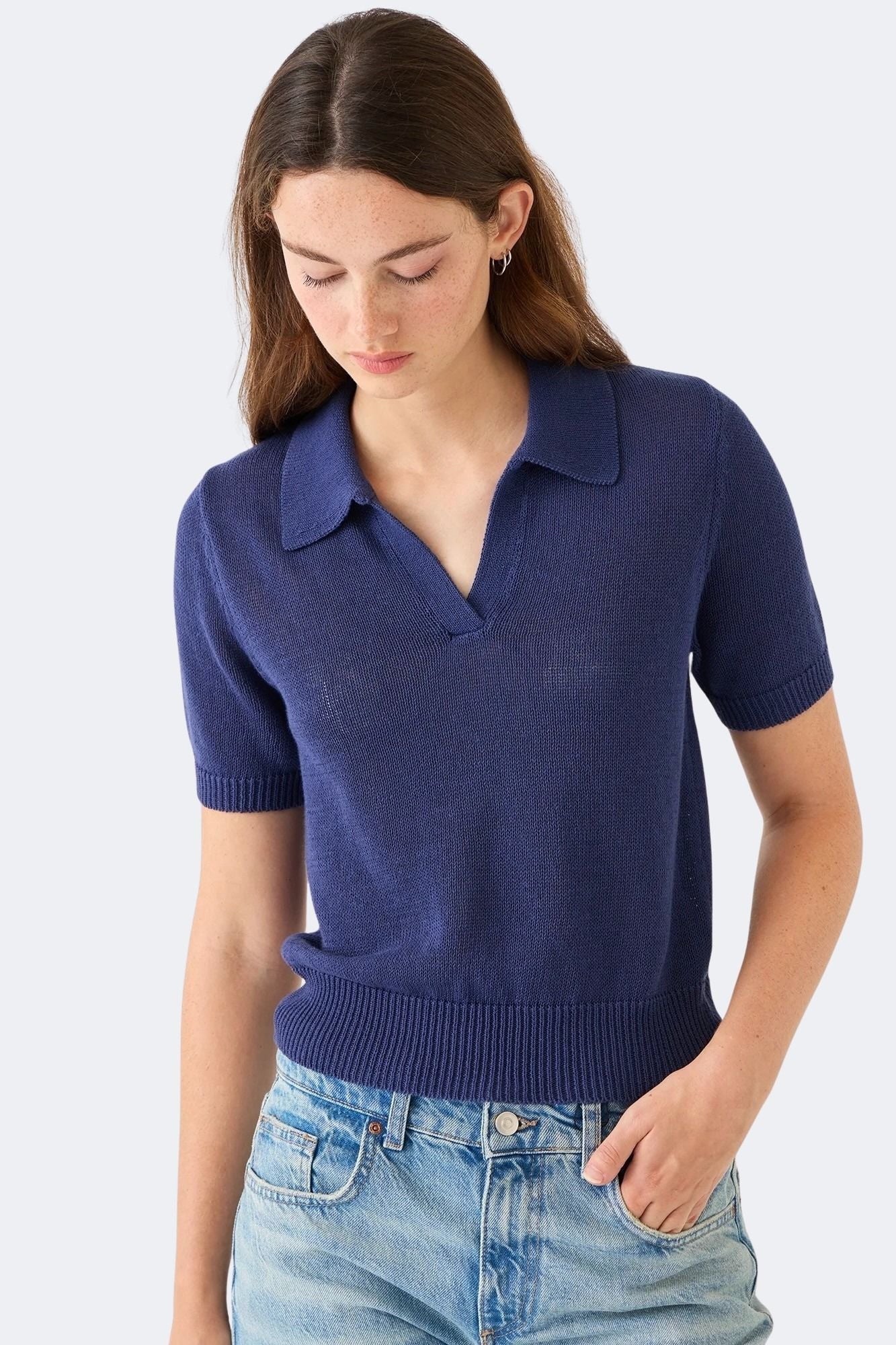 Front view of DEMYLEE Cris indigo cotton linen polo sweater styled with denim