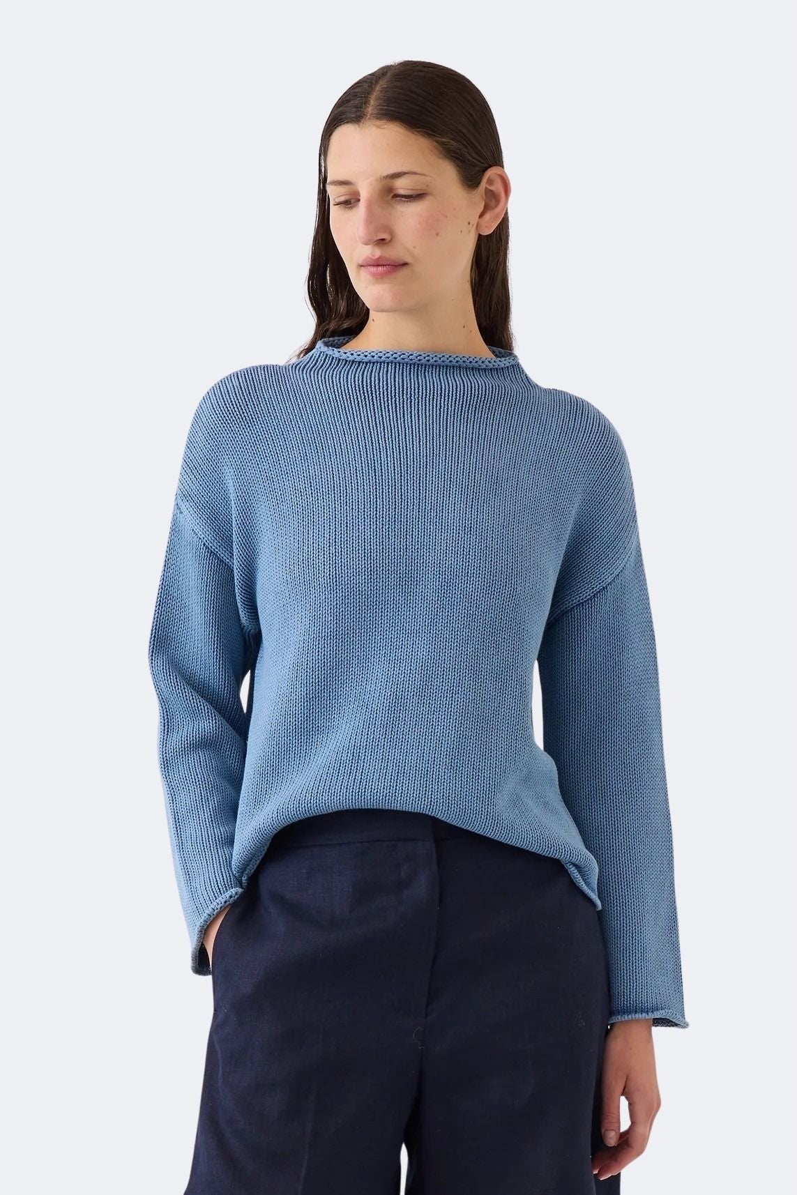 Model wearing DEMYLEE Lamis denim washed cotton sweater with dropped shoulders and relaxed silhouette