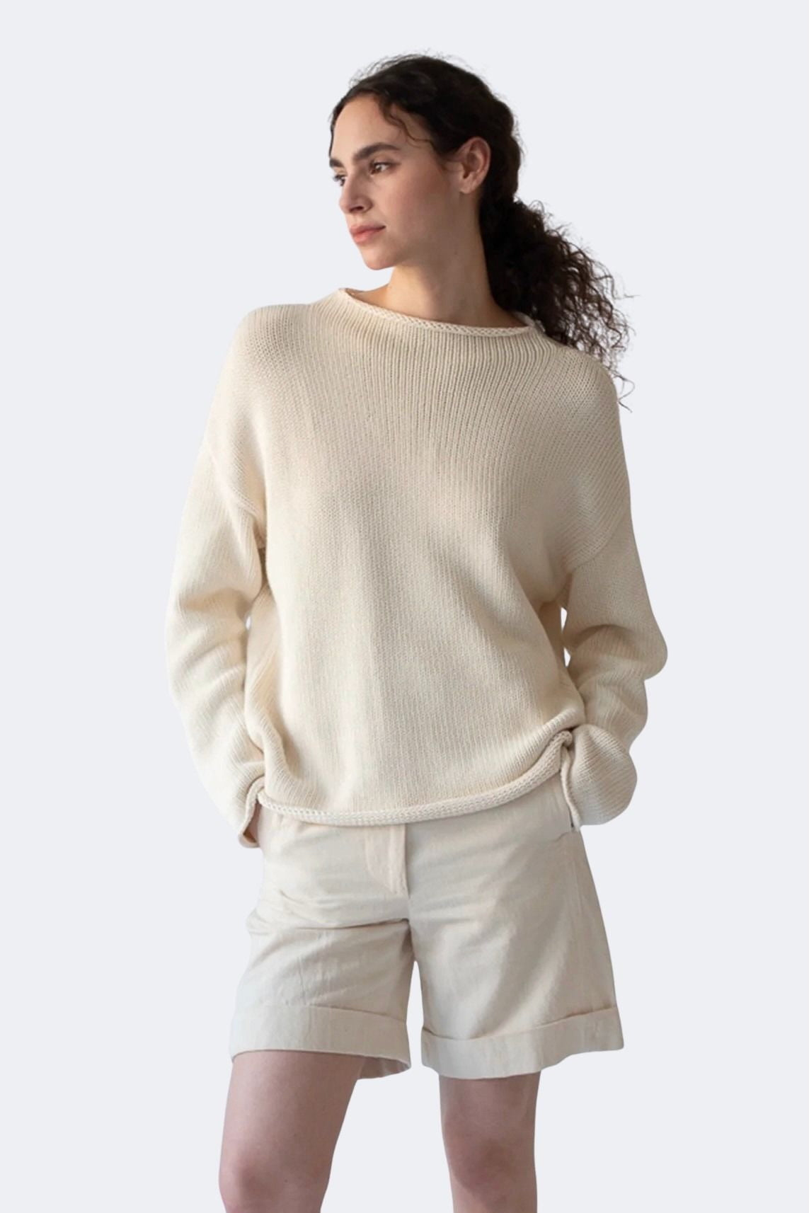 Close view of DEMYLEE Lamis off white cotton sweater showing textured knit and rolled hem detail