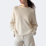 Close view of DEMYLEE Lamis off white cotton sweater showing textured knit and rolled hem detail