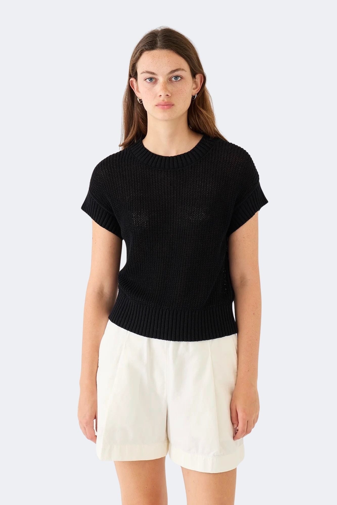Model wearing DEMYLEE Marlowe black cotton linen knit top with relaxed silhouette and ribbed trim