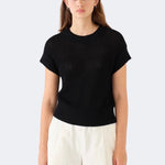 Model wearing DEMYLEE Marlowe black cotton linen knit top with relaxed silhouette and ribbed trim