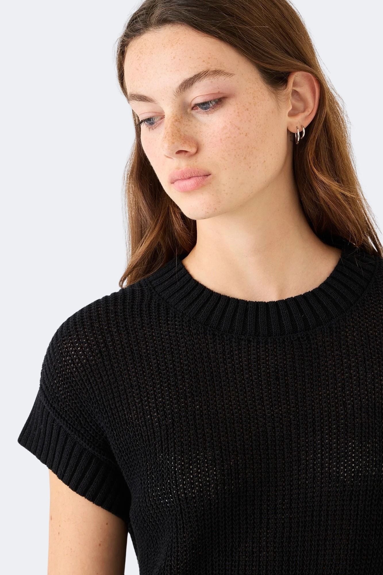 Close view of DEMYLEE Marlowe black cotton linen open weave knit top highlighting textured stitch pattern