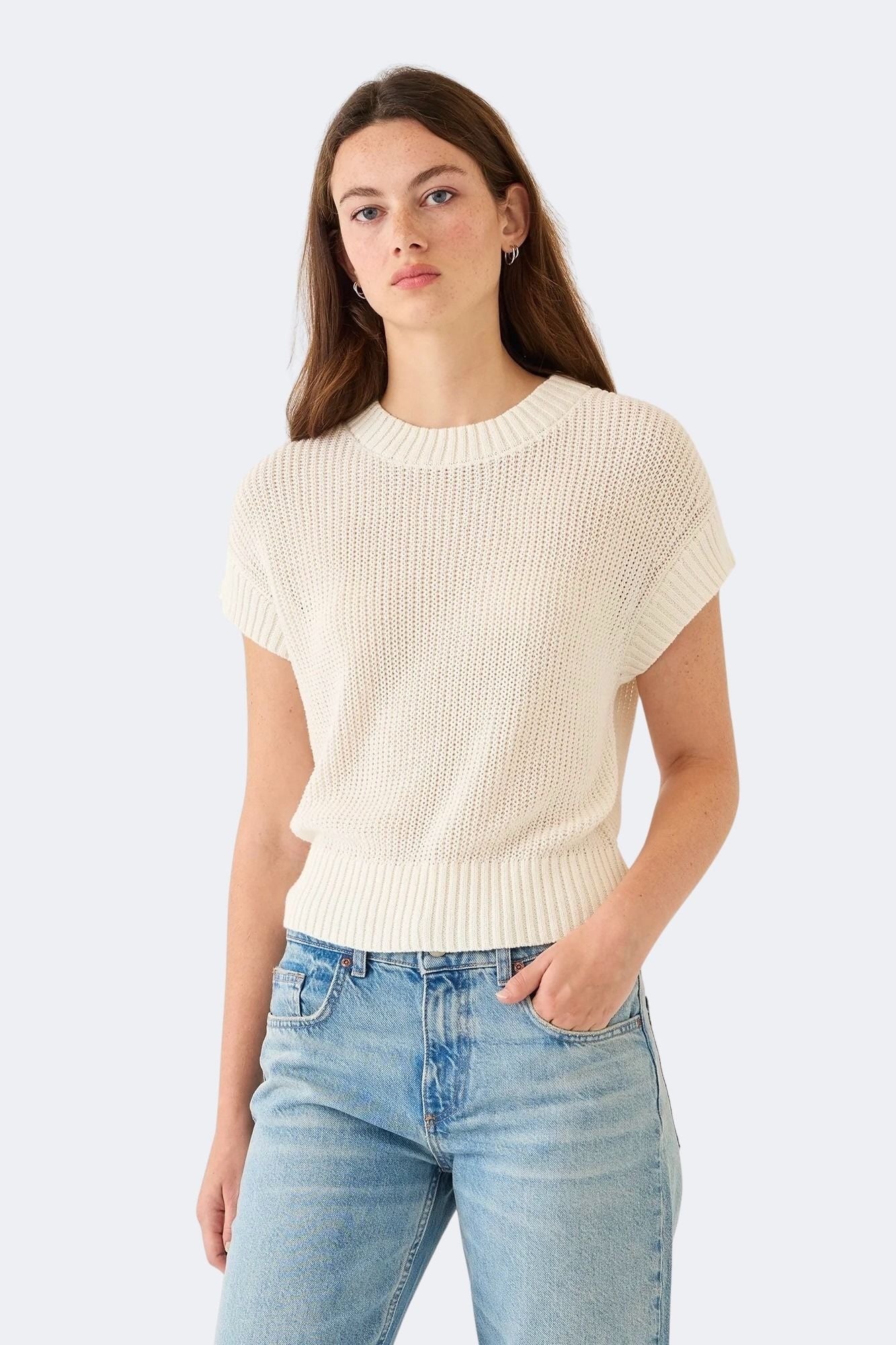 Model wearing DEMYLEE Marlowe off white cotton linen knit top with relaxed fit and ribbed trim