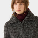 DEMYLEE Nessa Small Cashmere Scarf Garnet wrapped around the neck with a charcoal knit jacket