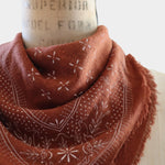 Eco Raw Studio Terracotta Classic Print Naturally Dyed Bandana in Terracotta x White Ink styled on a vintage dress form at YUCCA Denver