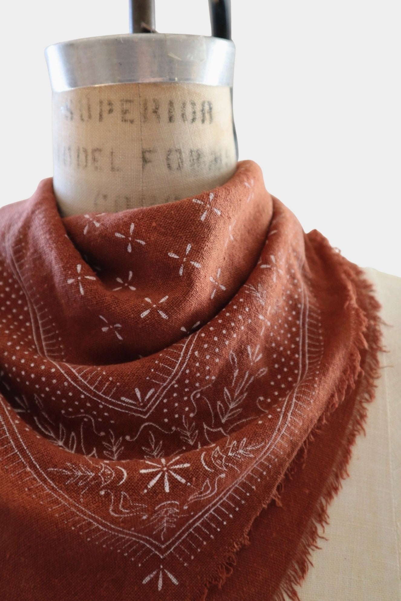 Eco Raw Studio Terracotta Classic Print Naturally Dyed Bandana in Terracotta x White Ink styled on a vintage dress form at YUCCA Denver