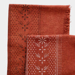 Eco Raw Studio Terracotta Classic Print Naturally Dyed Bandana in Terracotta x White Ink folded to show hand printed pattern