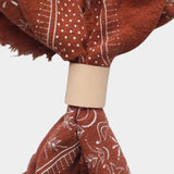 Eco Raw Studio Terracotta Classic Print Naturally Dyed Bandana in Terracotta x White Ink styled with a leather scarf ring