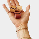 Eco Raw Studio leather bandana cuff dark brown worn on wrist holding bandana