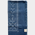 Eco Raw Studio ocean blue raw silk bandana with white print laid flat showing full square shape and border design