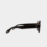 Side profile of Elisa Johnson Jane sunglasses in gloss black acetate with thick temples and tinted lenses