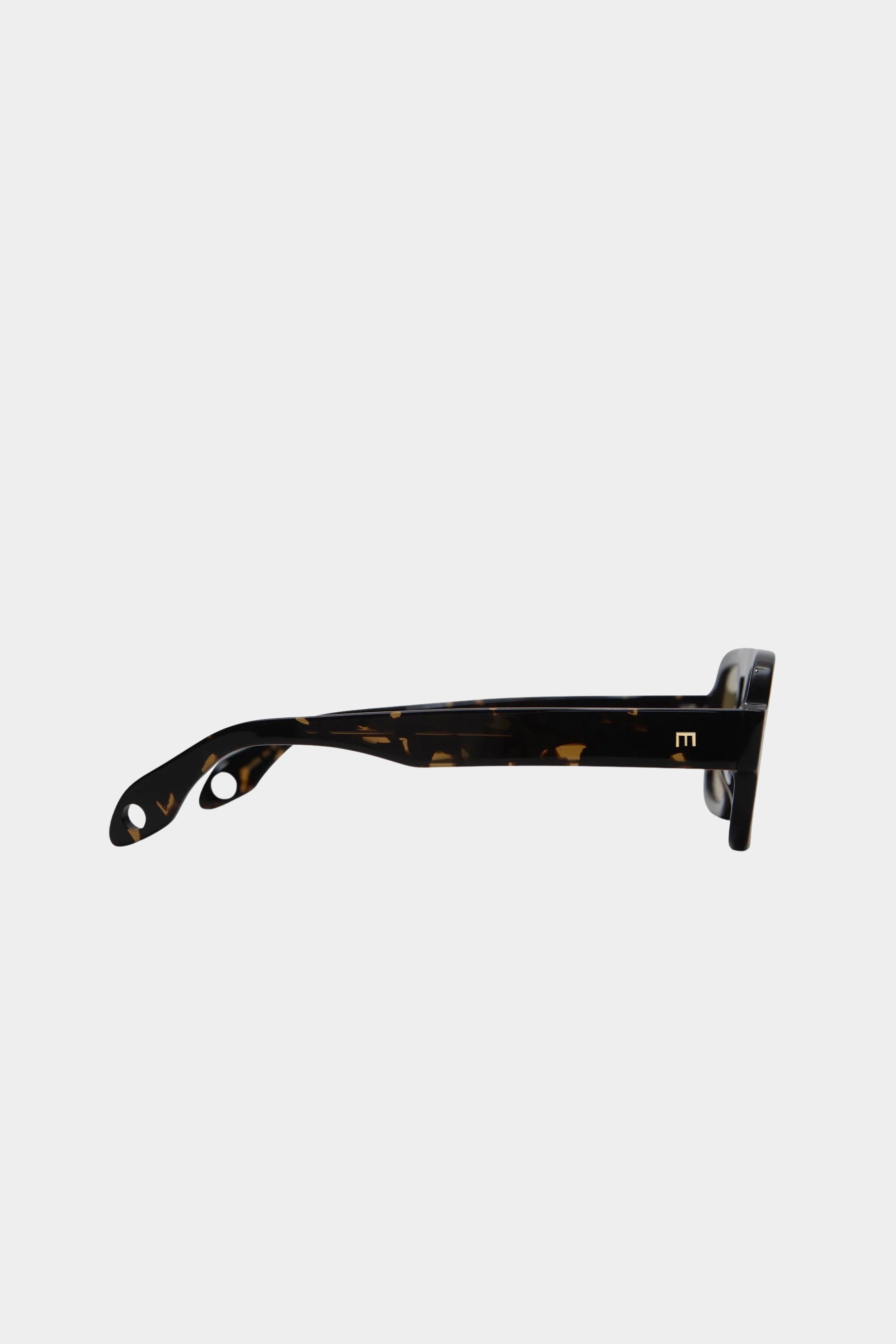 Side view of Elisa Johnson Jane Mini sunglasses in dark brown tortoise with gold temple logo at YUCCA Denver.