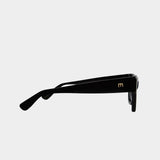 Side profile of Elisa Johnson Rae sunglasses in gloss black acetate with slim temples and tonal black lenses