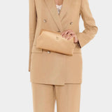 IL BISONTE Manuela leather clutch natural worn on model