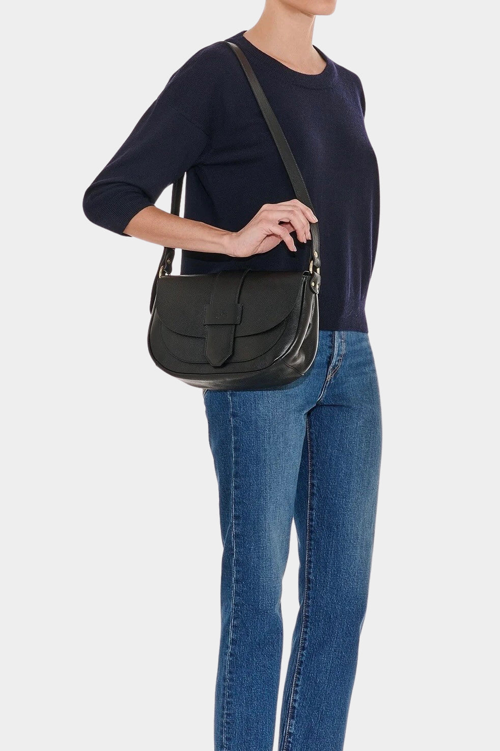 IL BISONTE black leather crossbody bag side profile worn on model