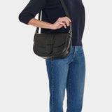 IL BISONTE black leather crossbody bag side profile worn on model