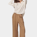 Model wearing the Jungmaven Cambria Pant in Coyote with an elastic waistband and easy pull-on fit