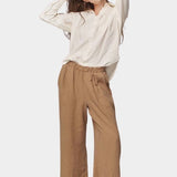 Model wearing the Jungmaven Cambria Pant in Coyote with an elastic waistband and easy pull-on fit