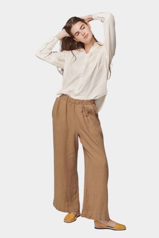 Model wearing the Jungmaven Cambria Pant in Coyote with an elastic waistband and easy pull-on fit