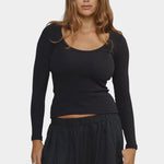 Woman wearing Jungmaven Paseo Long Sleeve Tee in Black, front detail view